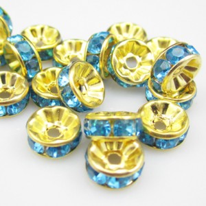 20 x vergulde rondel met aquablauwe strass, 8mm